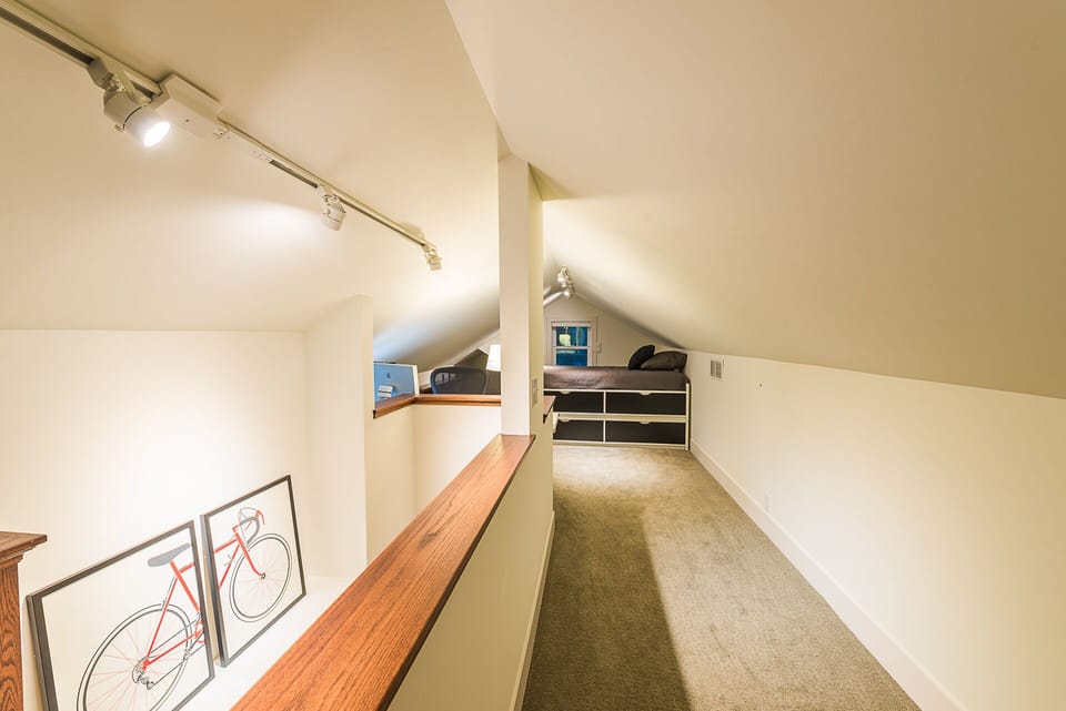 Upper loft with two twin beds combined for a king bed