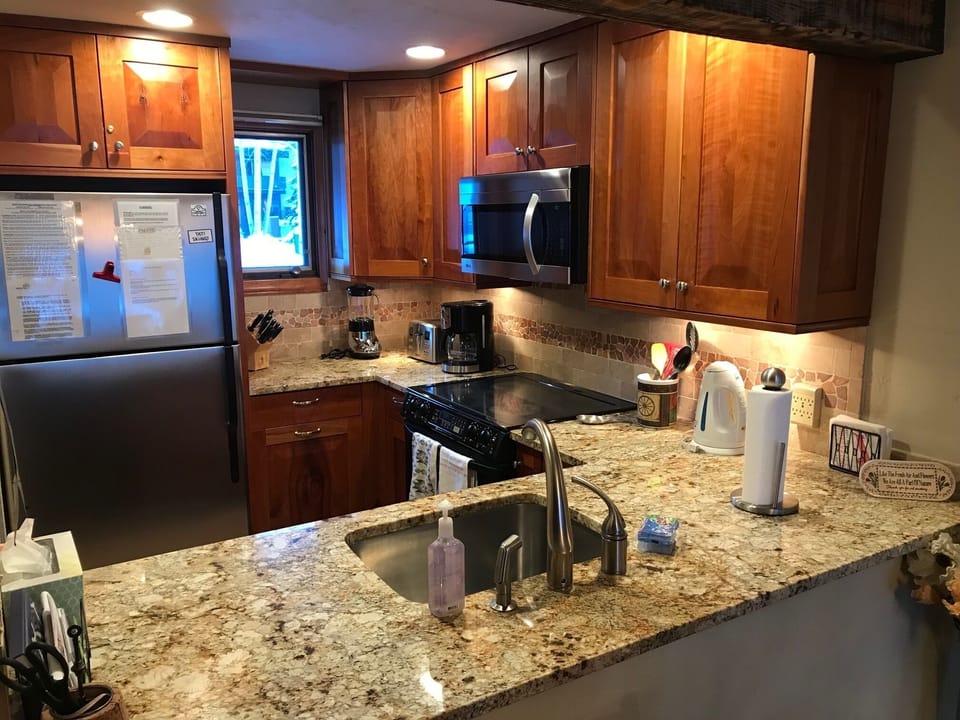Fully-equipped kitchen with under-cabinet lighting