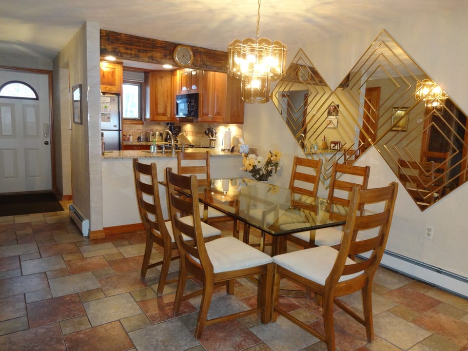 Dining room glass-top table with seating for six.