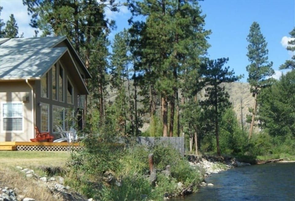 The house is 16 feet from the riverbank. Deck is 18 inches from the riverbank.