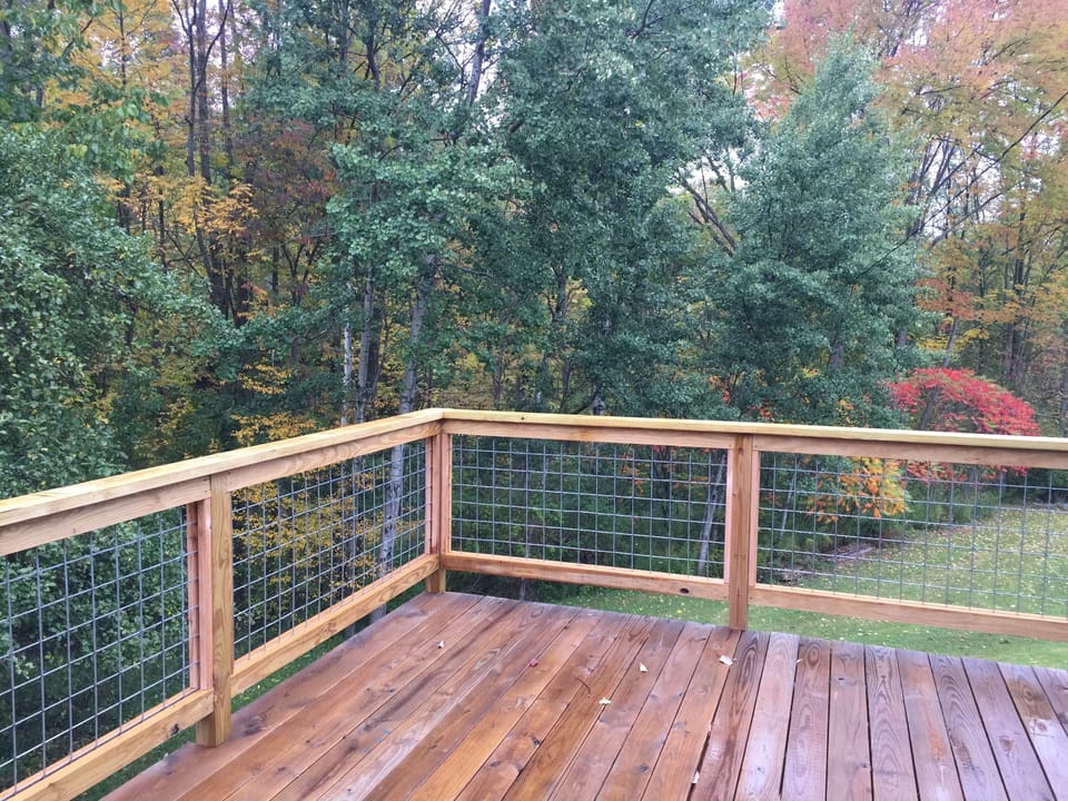 Large deck overlooking the woods and stream. Patio tables and chairs. Gas BBQ. 