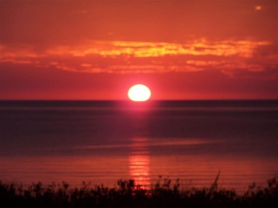 Beautiful sunsets from our deck or with a bonfire at the beach