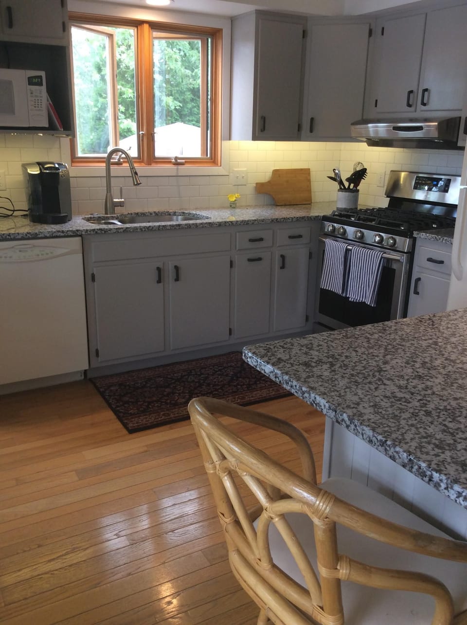 Kitchen with gas stove and breakfast bar