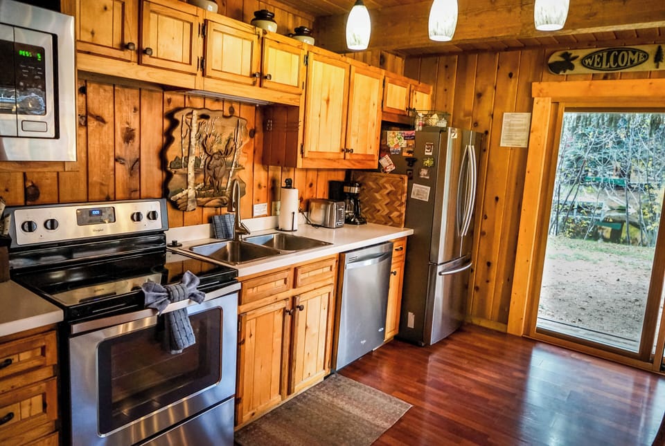 Beautiful kitchen that is amply stocked for your cooking needs. 