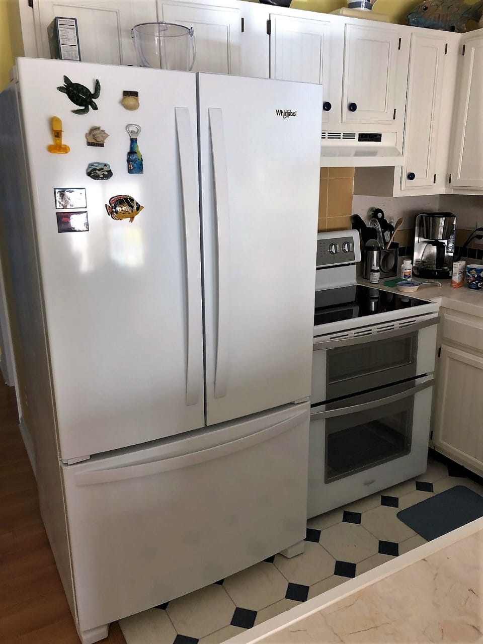 Brand new French door refrigerator with bottom freezer and ice maker.