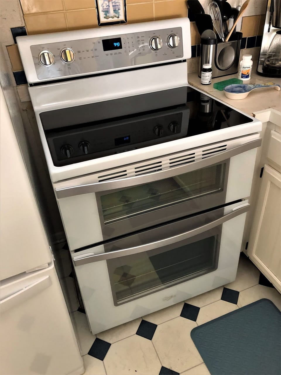 Brand new double oven with glass-top range.