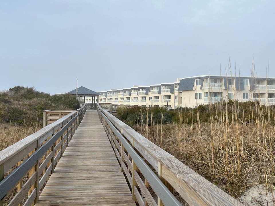Boardwalk from beach to resort
