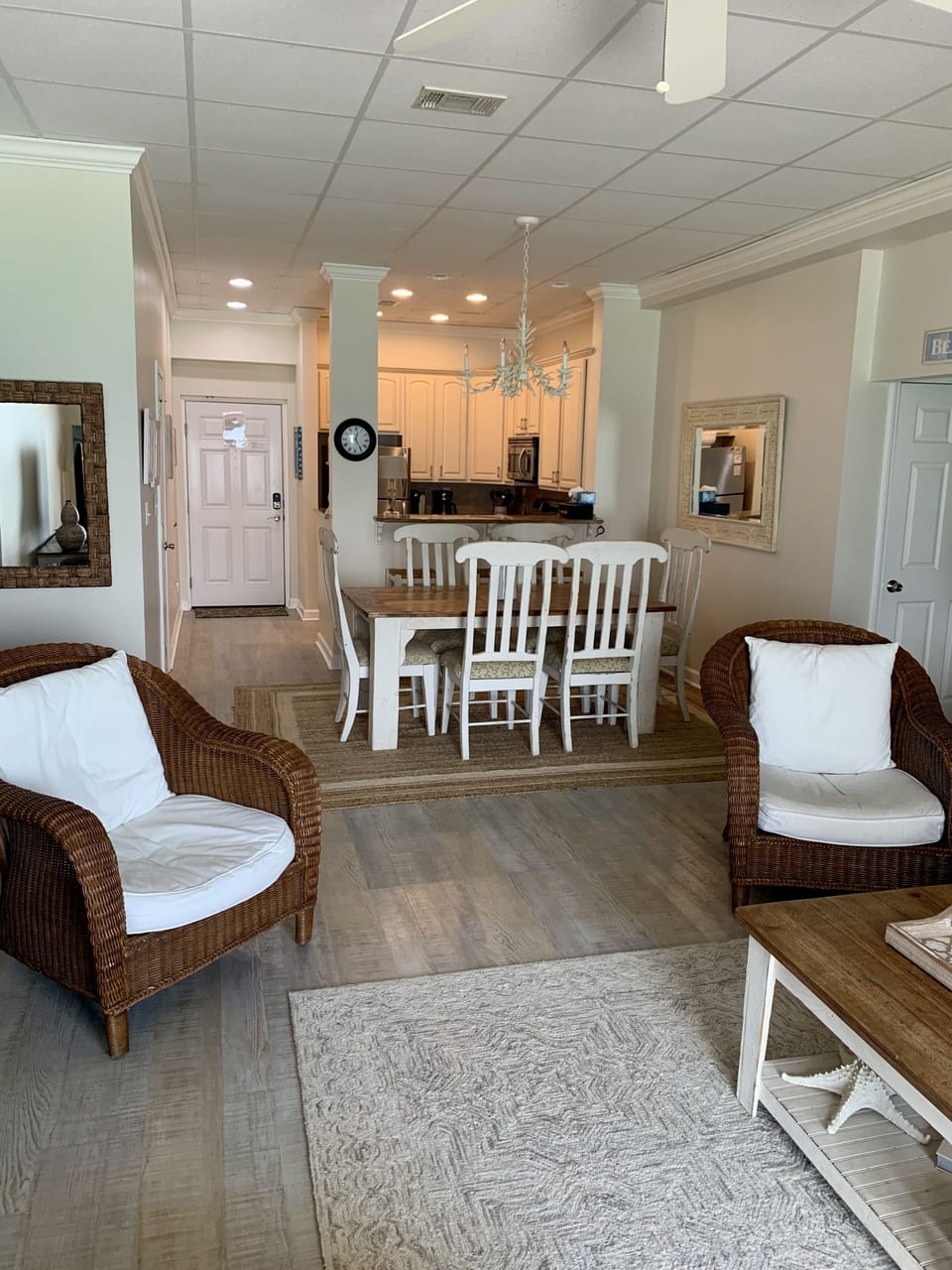 from living room looking into entry, kitchen and dining area