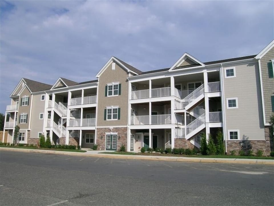Front exterior of condo building which also has an elevator