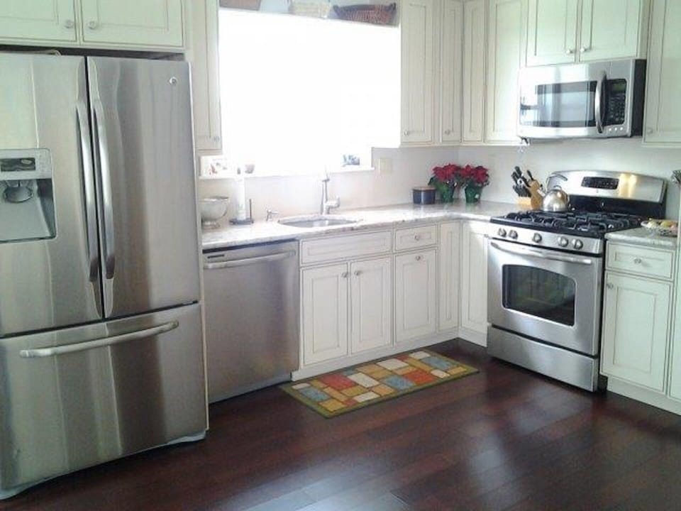 Upgraded kitchen with granite counter tops and stainless steel appliances