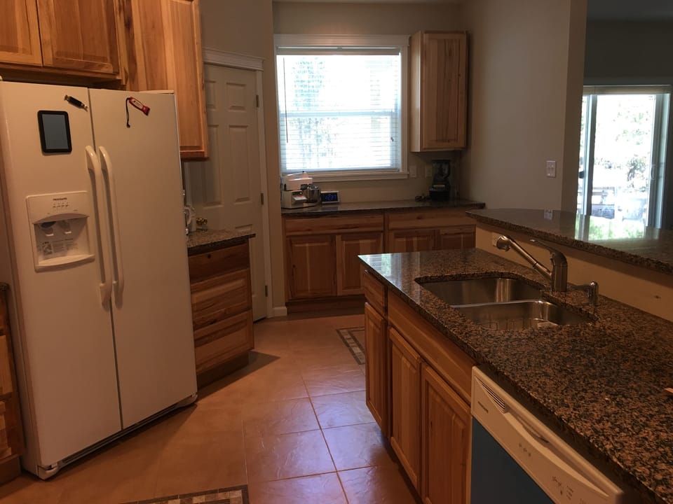 Kitchen open to main living room and has adjoining formal dining room