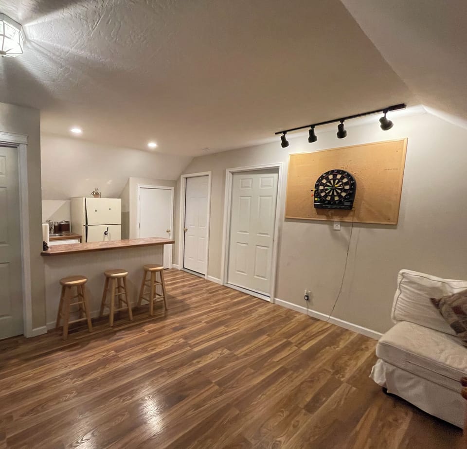 Game room w/wet bar.  Game room includes electronic darts,  board games, cards..