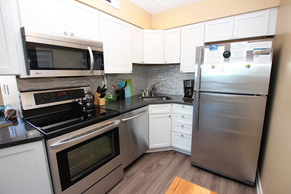 Kitchen with quartz countertops and metallic backsplash (sparkly!!)