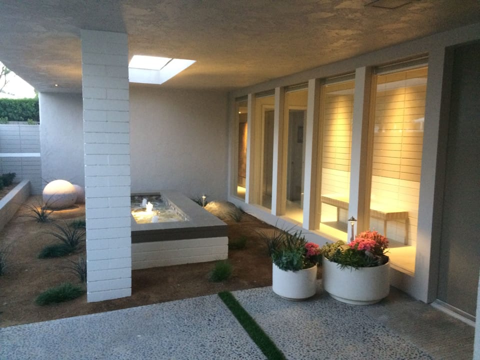 Lighted fountain just inside front gate 