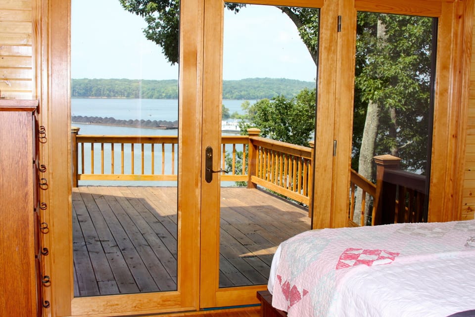 Watch barges passing by with this incredible view from the master bedroom.