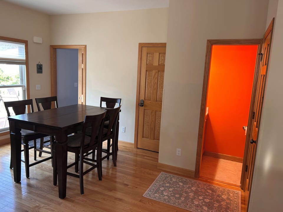 There's a 2nd table for dining next to the kitchen and two chairs at the island.