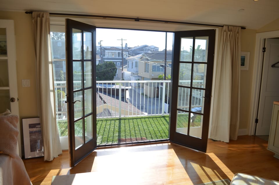 French doors off of guest room open to private deck