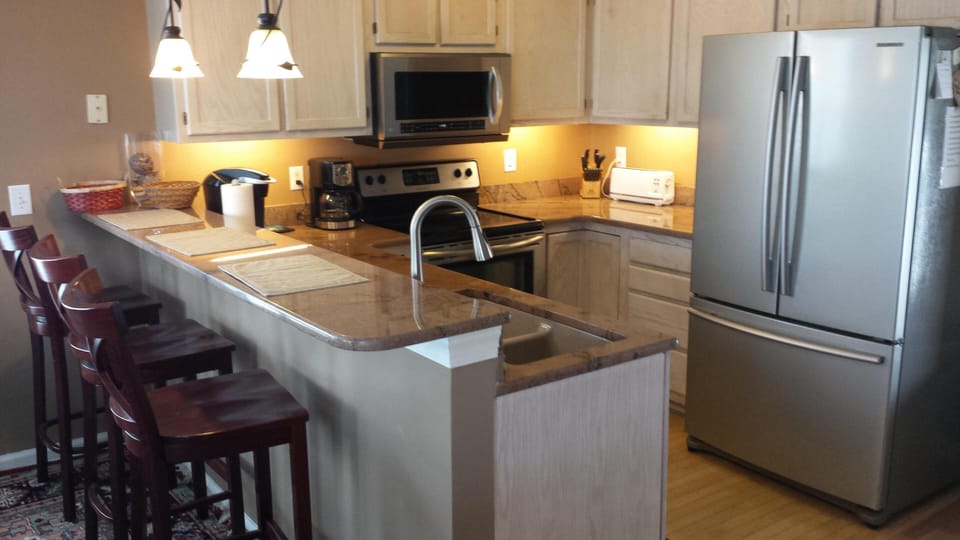 kitchen w/ new granite and motion delta faucet