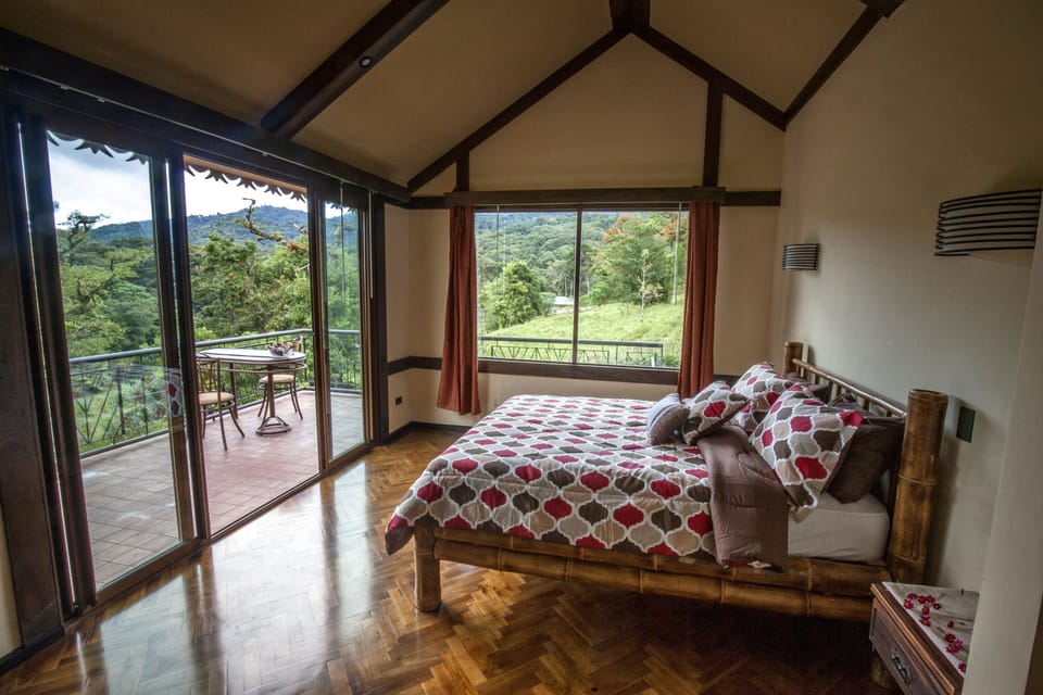 Room with hot tub and private balcony.