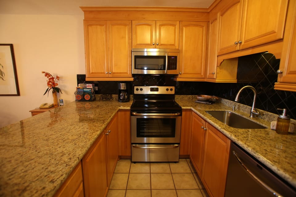 Stainless steel sink and appliances round out this upgraded kitchen.