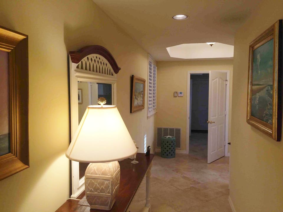 Spacious hall leading to laundry room and garage