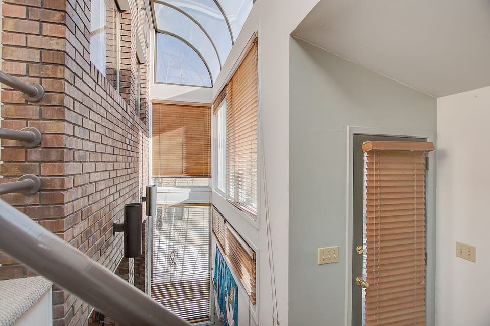 Skylight adding light to all rooms of the Condo. Door to hot tub deck. 