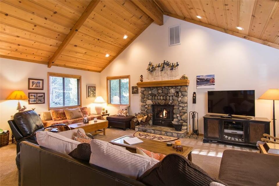 Large Great Room with River Rock Wood-burning Fireplace