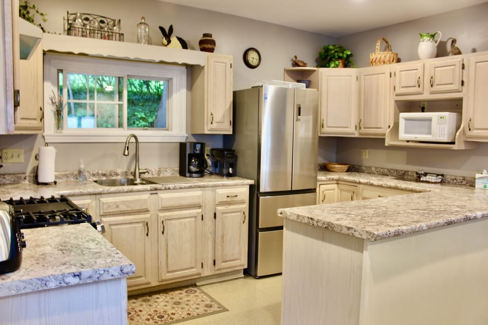 Additional serving dishes under breakfast bar  -  games and puzzles, too.
