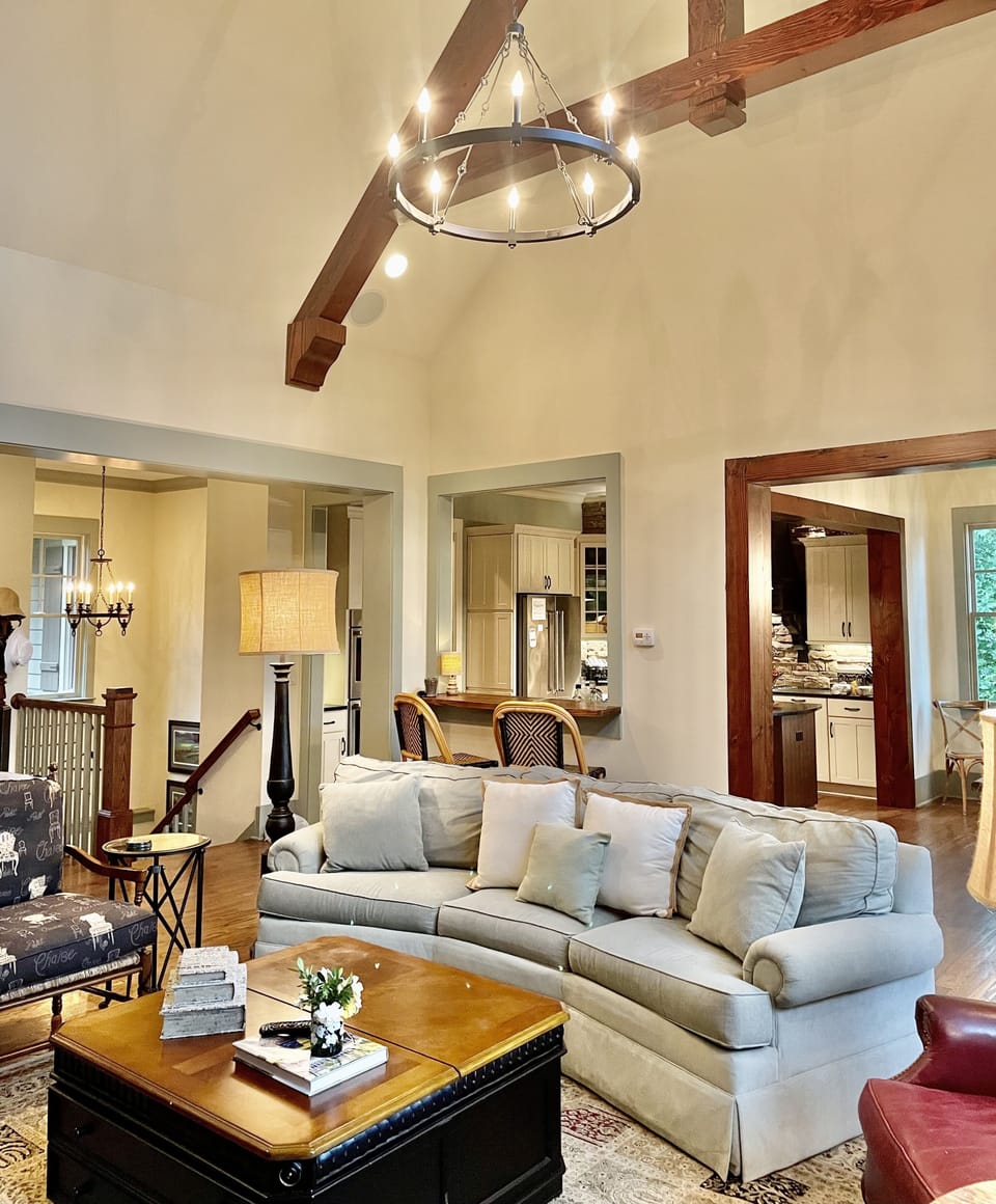 Open living area with view of steps down to lower level.