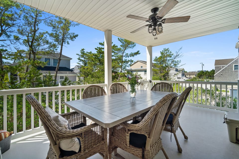 Covered Patio off Kitchen.  Spiral staircase to backyard.  