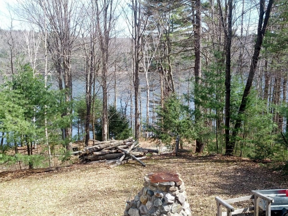 View of Fire Pit, Yard, and Lake from Deck