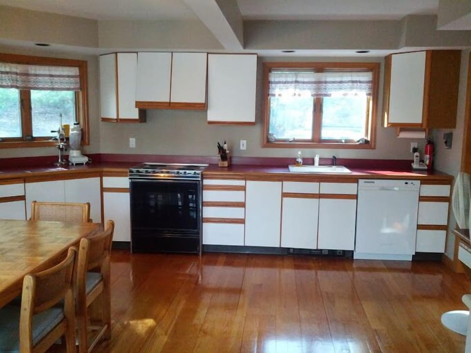 Modern Kitchen, open to Dining Room, Lake and Forest Views.