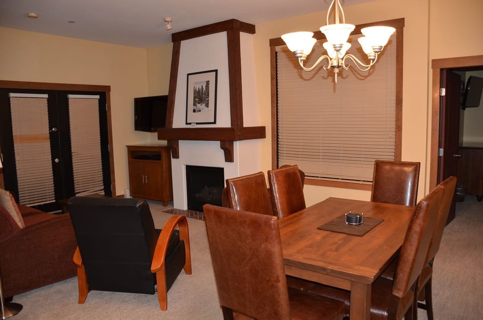 Living / Dining Room with Fireplace & Sleeper Sofa