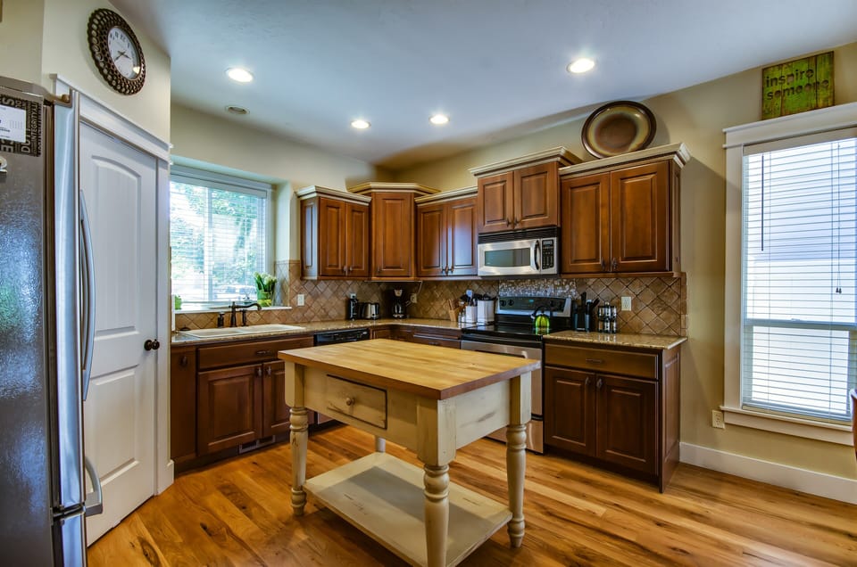 Kitchen w/butcher block island, hardwood floors, pantry