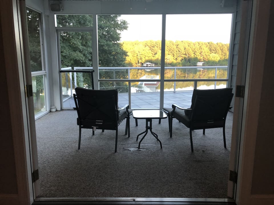 Private screened porch off the Captain's Suite. Wake up to the perfect view!