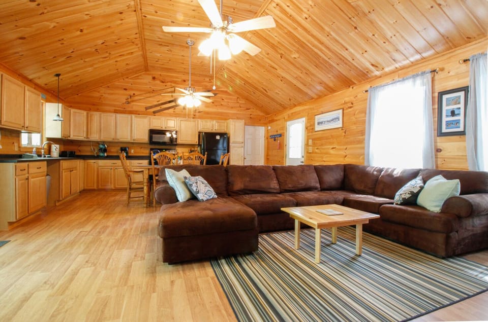 The Great Room with Cathedral Ceilings and large comfy couch