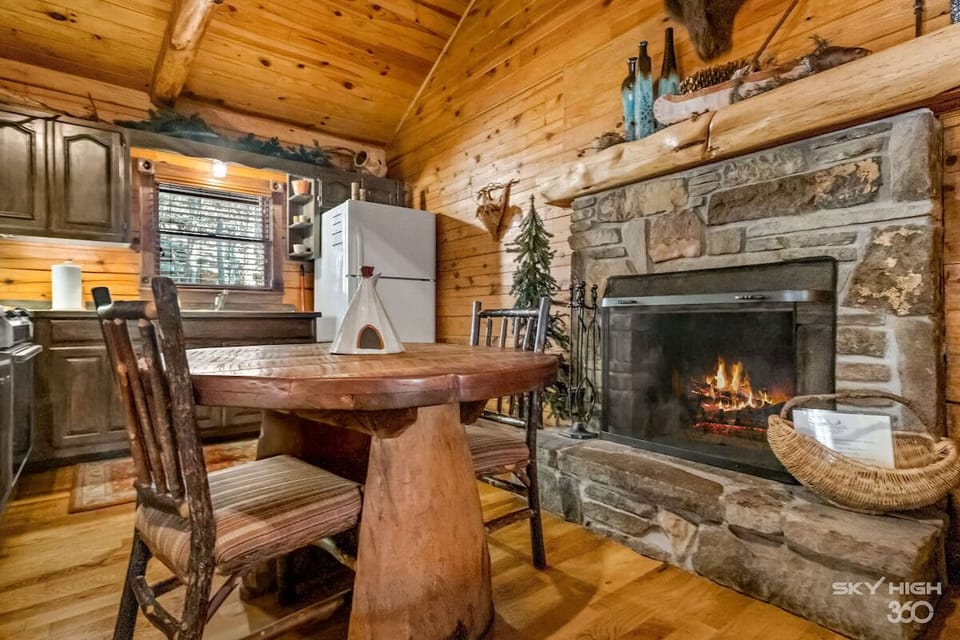 Enjoy a romantic dinner in front of the native stone fireplace.