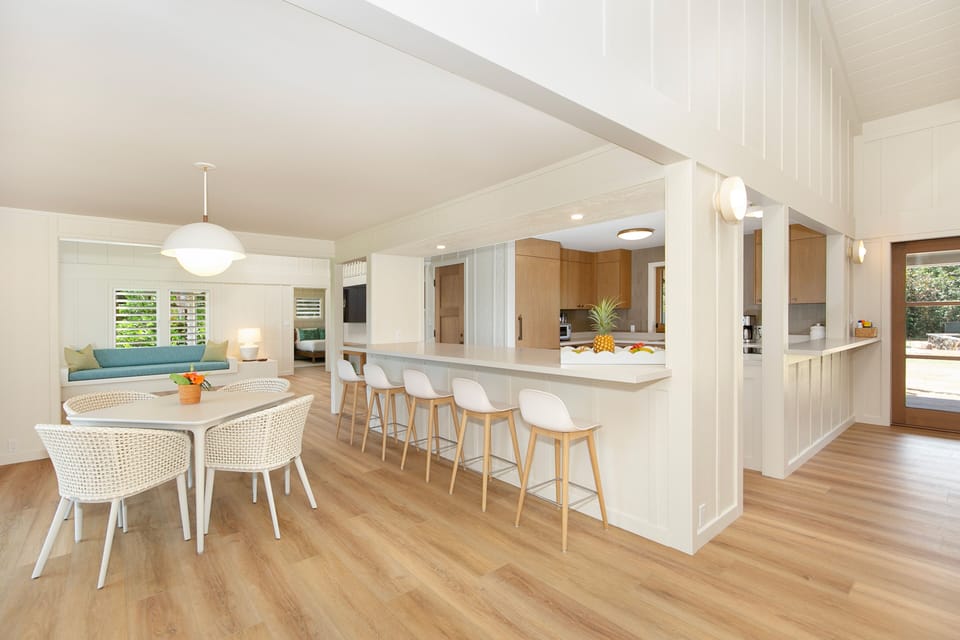 Game Table with Breakfast Bar, Kitchen, and Doors to Mauka Lanai at Right