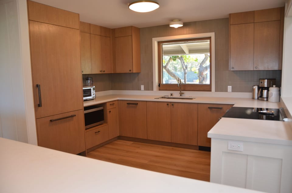 Kitchen, with Fridge to Left, and Window to Mauka Lanai.