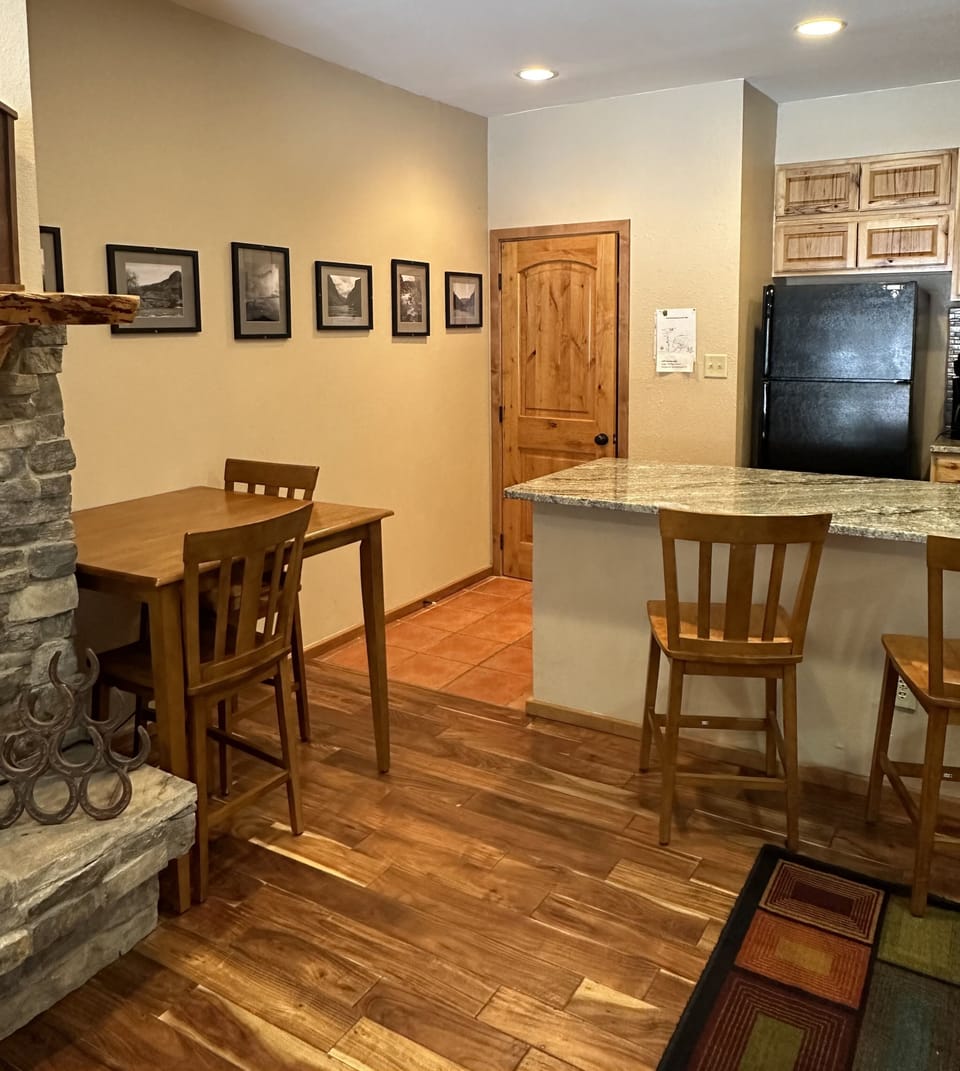 Small & roomy. Move the table out, put all the chairs around it to eat together
