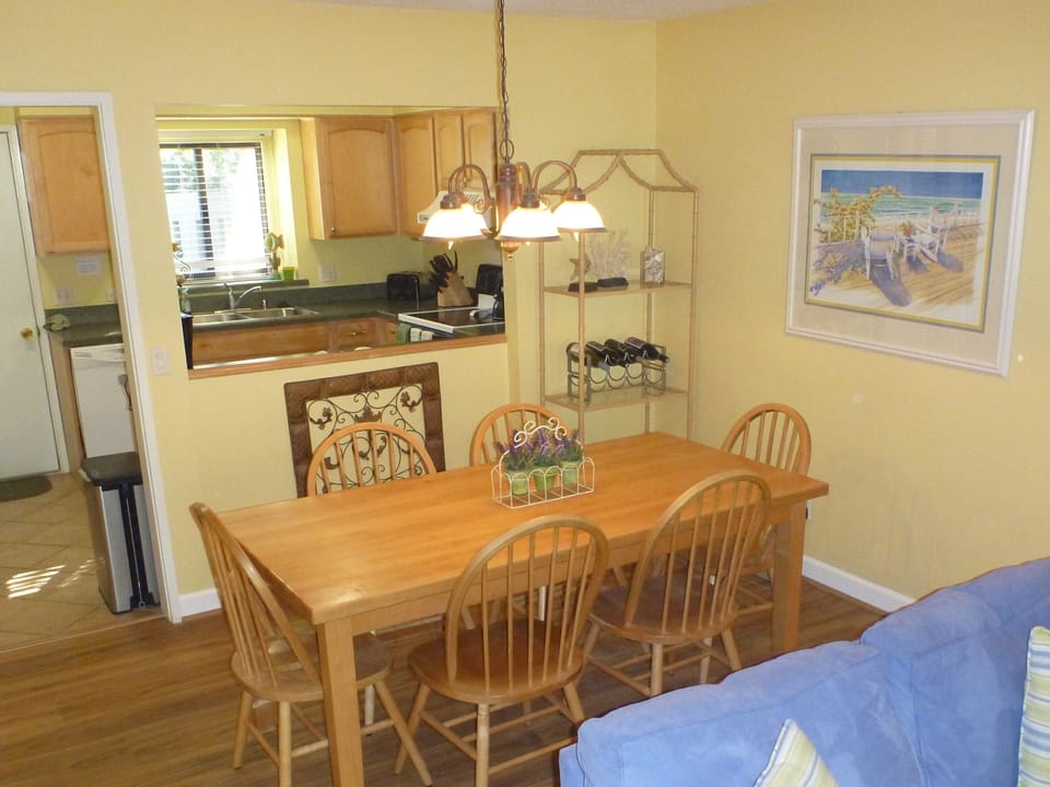  Dining Room and Kitchen beyond. older appliances in background.  