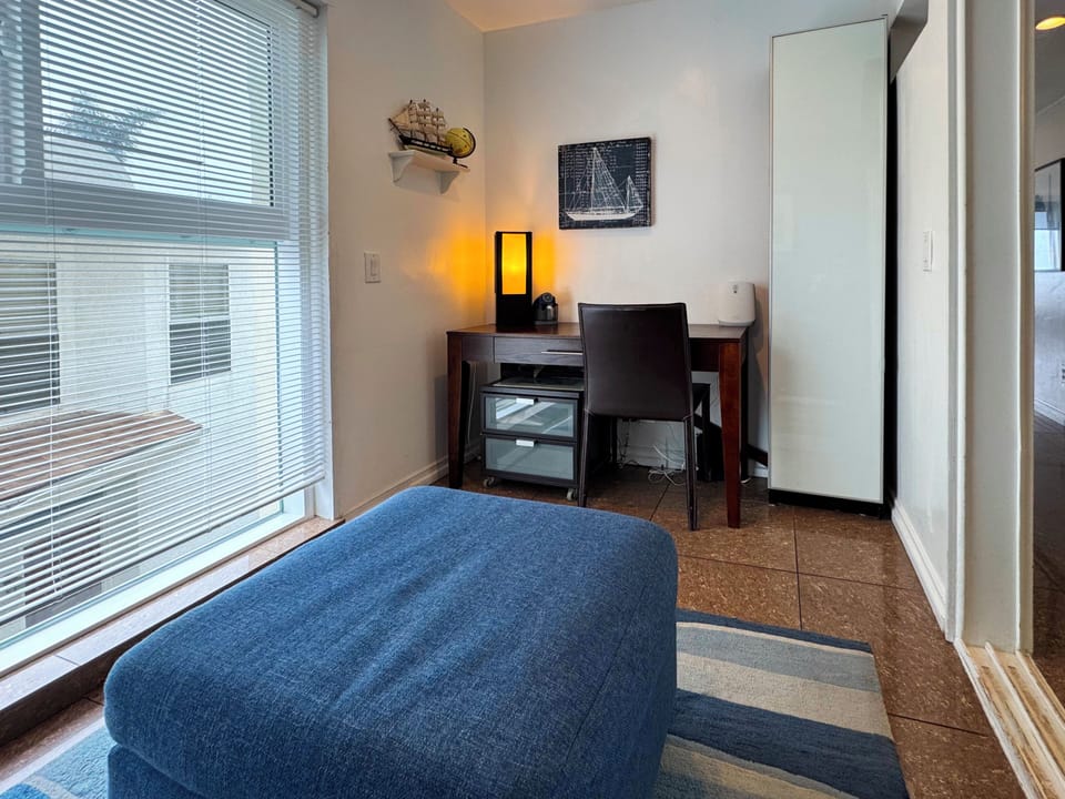 Den with desk for remote work - room has a door for privacy