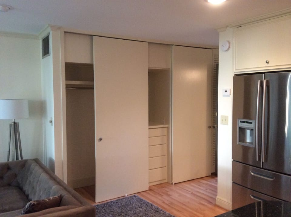 Generous storage. Two sliding-door closets flank a built-in 5-drawer dresser.