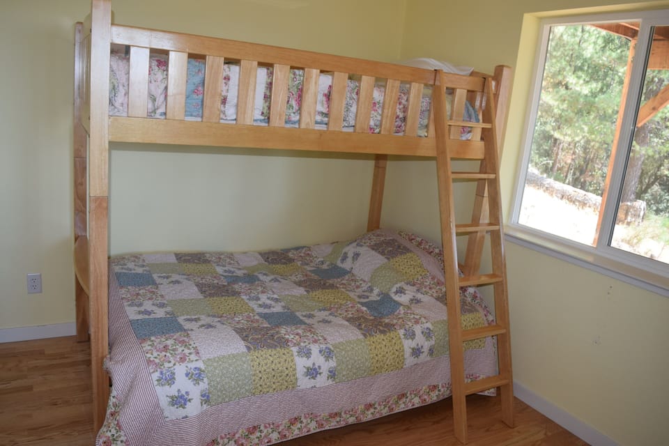 Yellow room has futon with twin bunk.