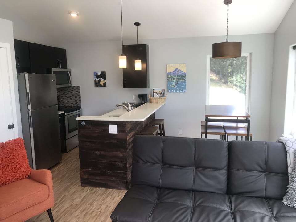 Dining table with 4 stools plus 2 stools at the bar. Games in the pantry closet.