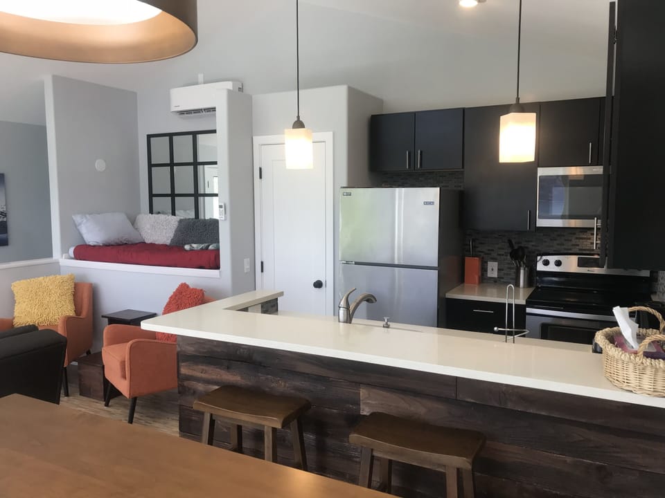 Well-appointed kitchen adjacent to cozy sitting area