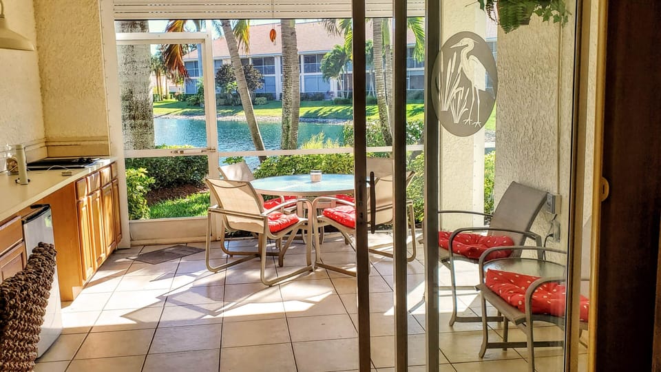 Looking from living room through lanai to lake.