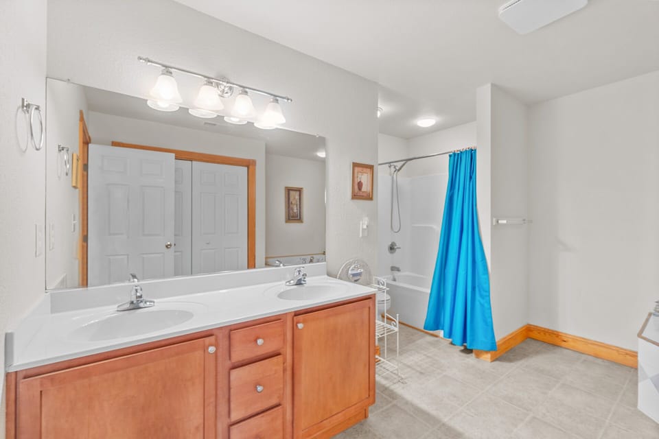 A full private bathroom with deluxe features is attached to the home's king master.