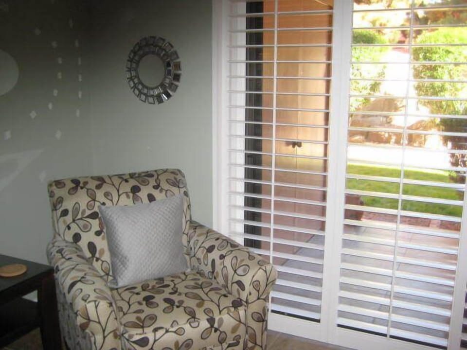 Chair showing the plantation shutters throughout