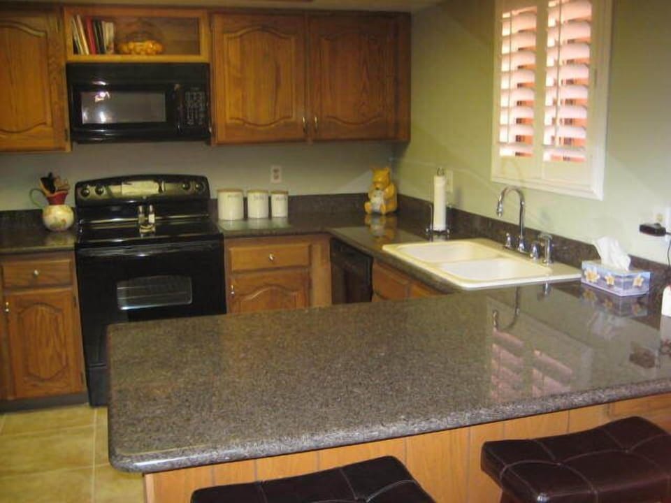 Newly remodeled kitchen featuring granite countertops